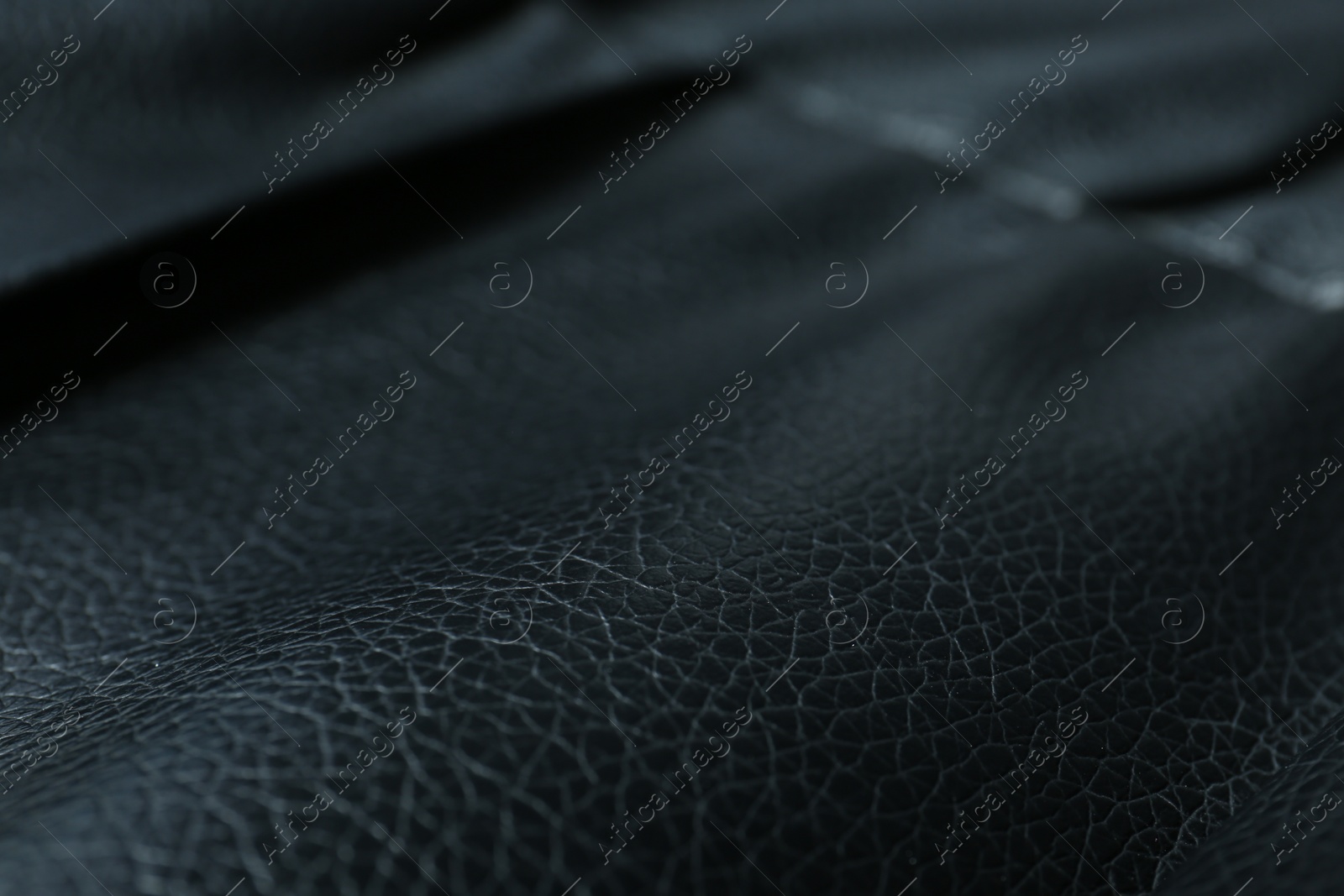 Photo of Black natural leather as background, closeup view