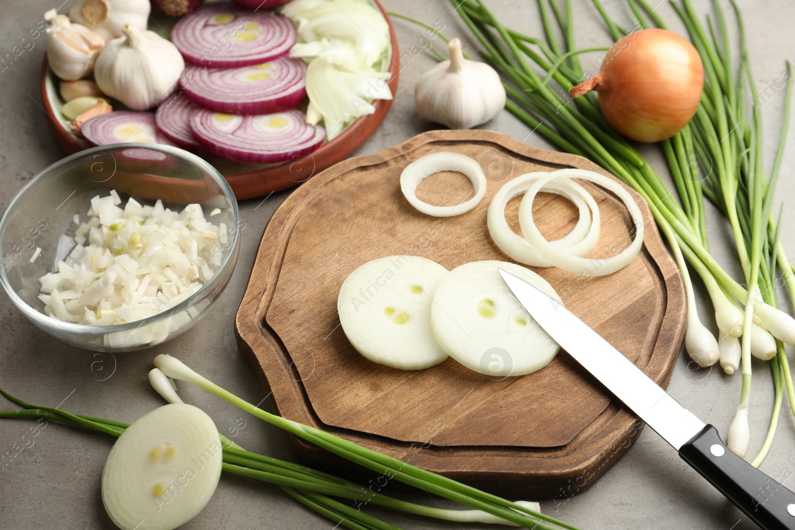 Photo of Composition with fresh onion on grey table