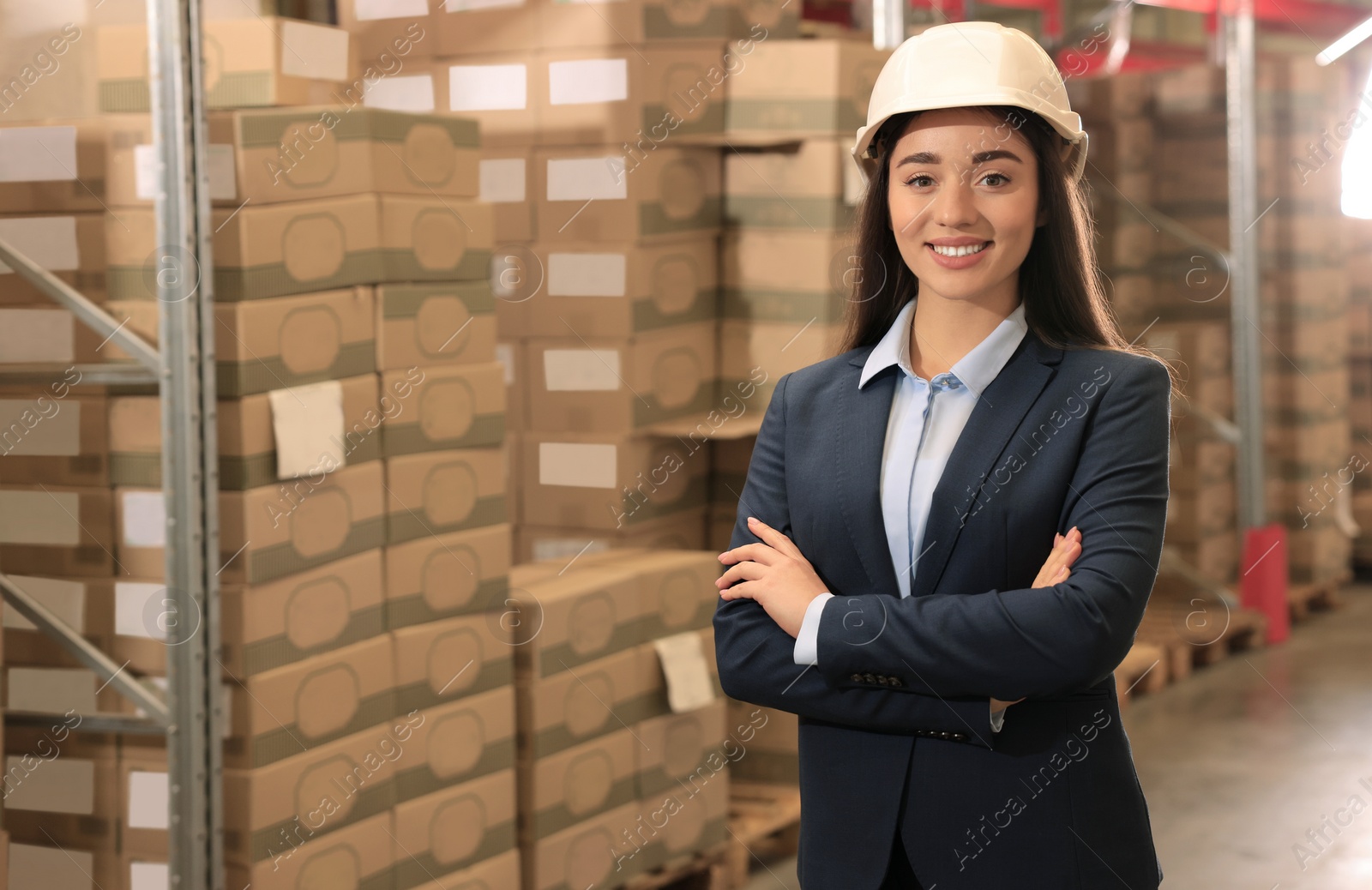 Image of Manager in hardhat at warehouse. Logistics center