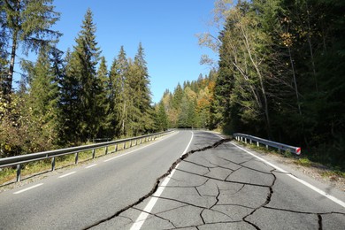 Large cracks on asphalt road after earthquake