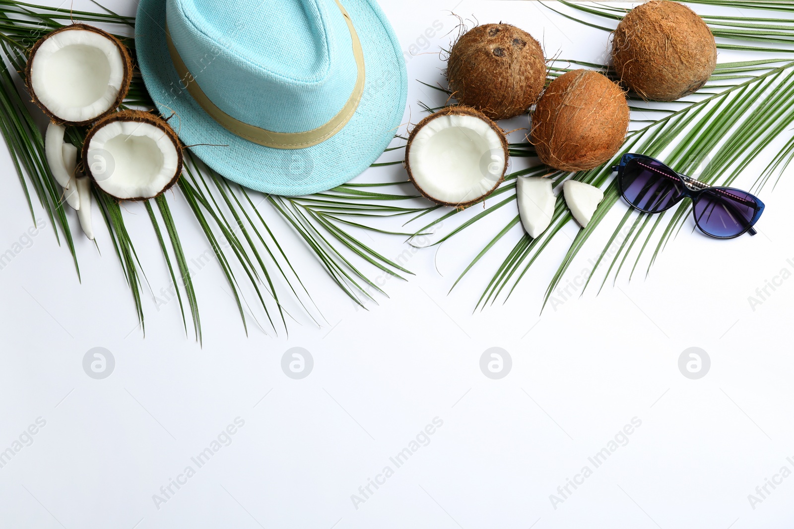 Photo of Creative composition with coconuts on white background, top view