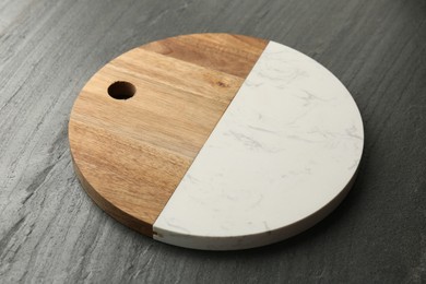 Photo of One new cutting board on dark grey table