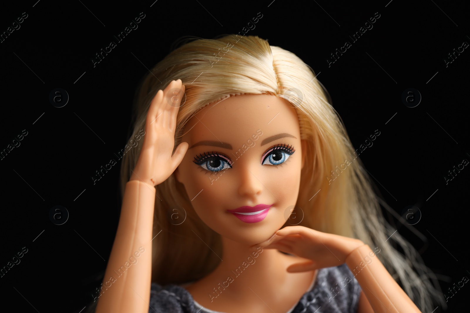 Photo of Mykolaiv, Ukraine - September 1, 2023: Beautiful Barbie doll on black background