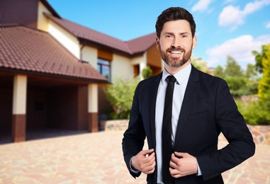 Image of Happy real estate agent near beautiful house outdoors. Space for text