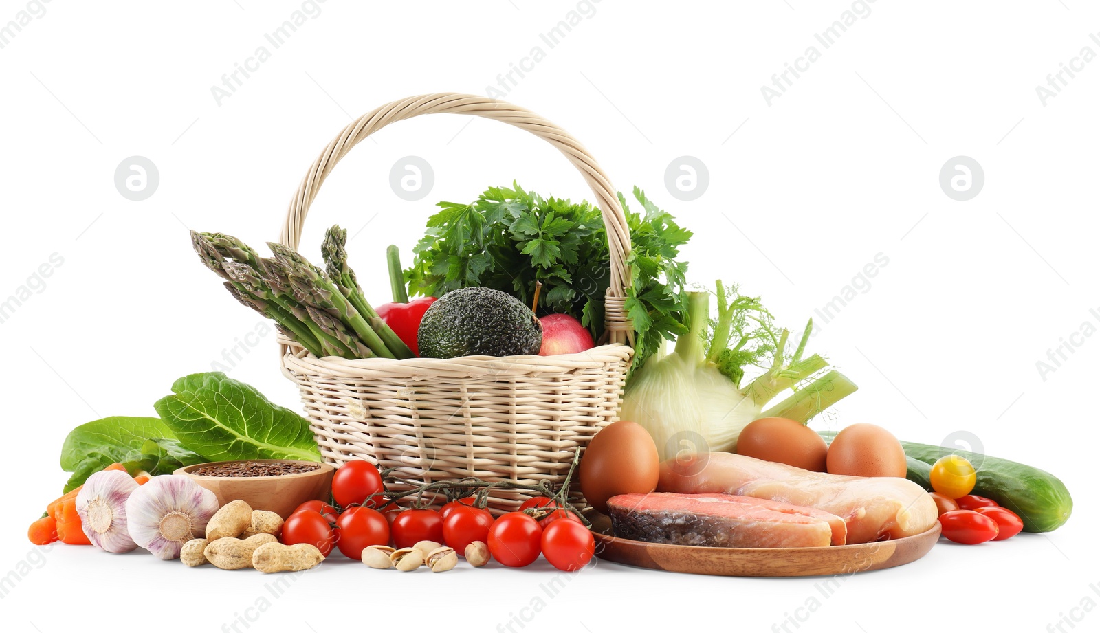 Photo of Healthy food. Basket with different fresh products isolated on white