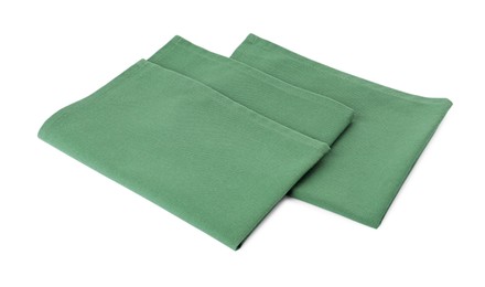 Photo of New clean green cloth napkins isolated on white