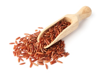Photo of Scoop and uncooked brown rice on white background