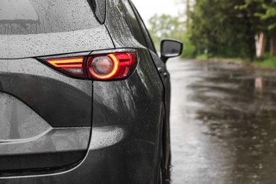 Car parked outdoors on rainy day, closeup