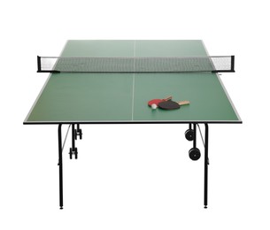 Photo of Green ping pong table with rackets and ball isolated on white
