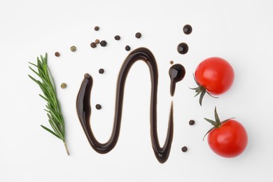 Organic balsamic vinegar and cooking ingredients on white background, flat lay