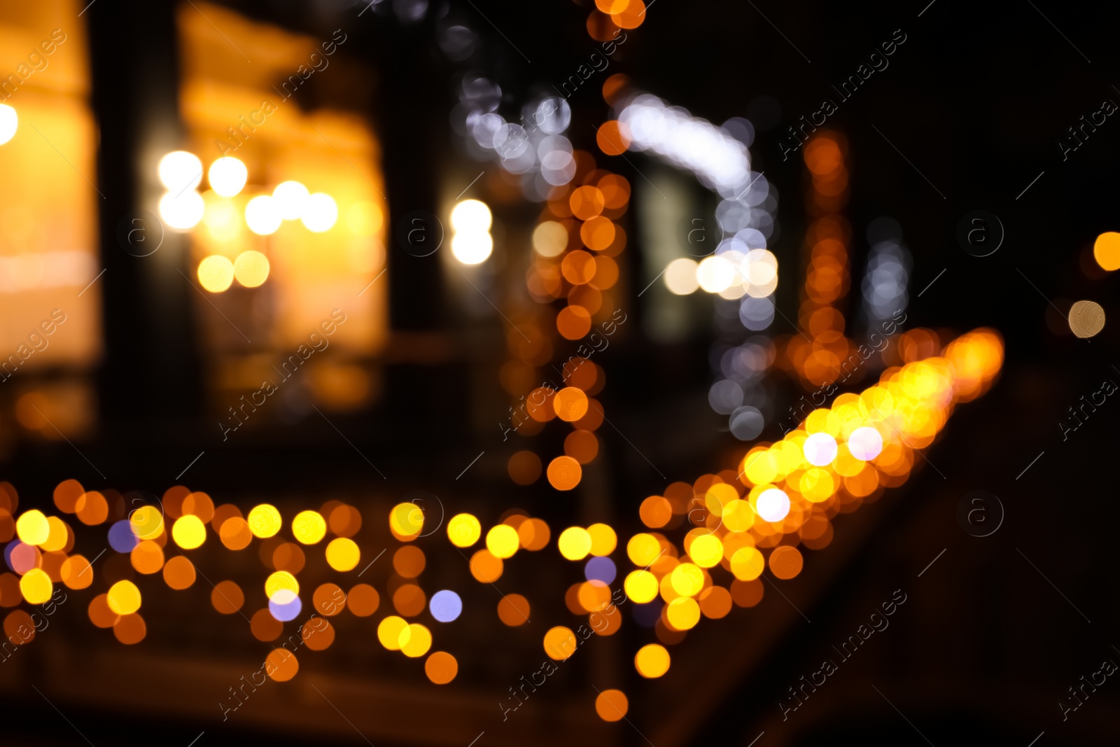 Photo of Beautiful street lights at night. Bokeh effect