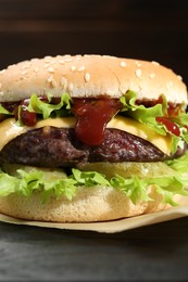Photo of Burger with delicious patty on table, closeup