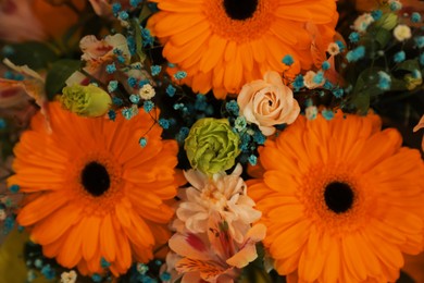 Beautiful bouquet with orange flowers as background, closeup