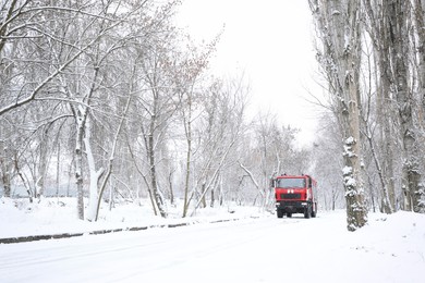 Modern fire truck on snowy country road