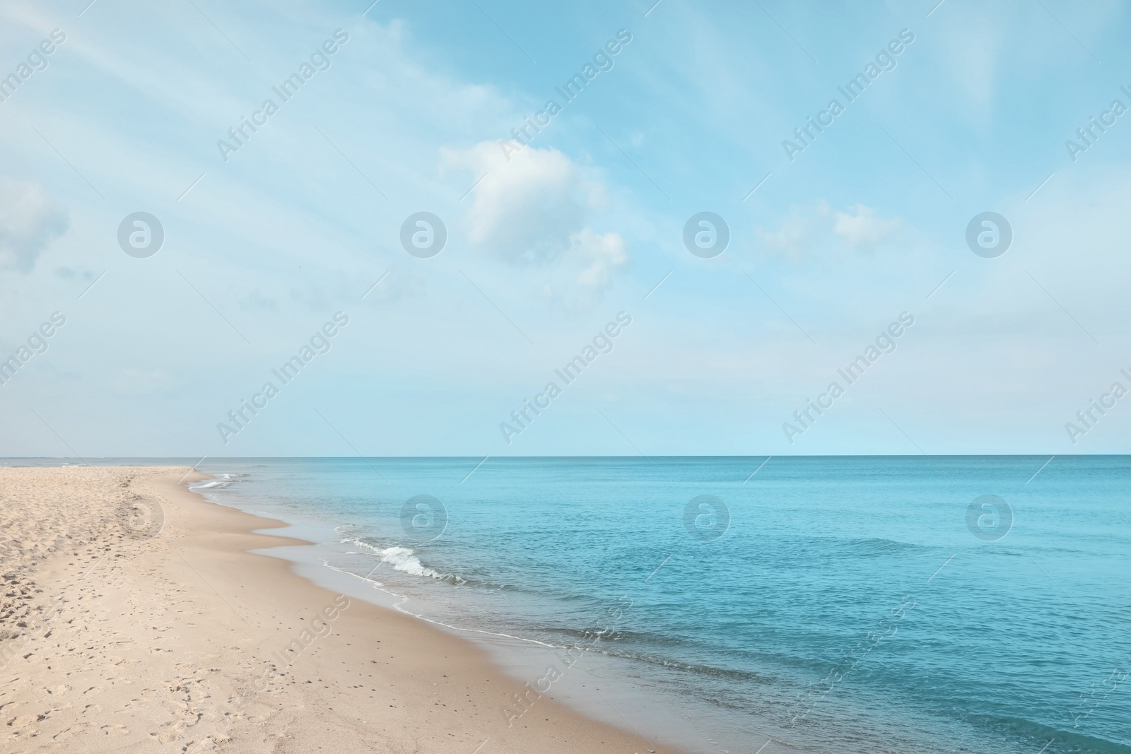 Photo of Beautiful view of sea shore under blue sky on sunny day