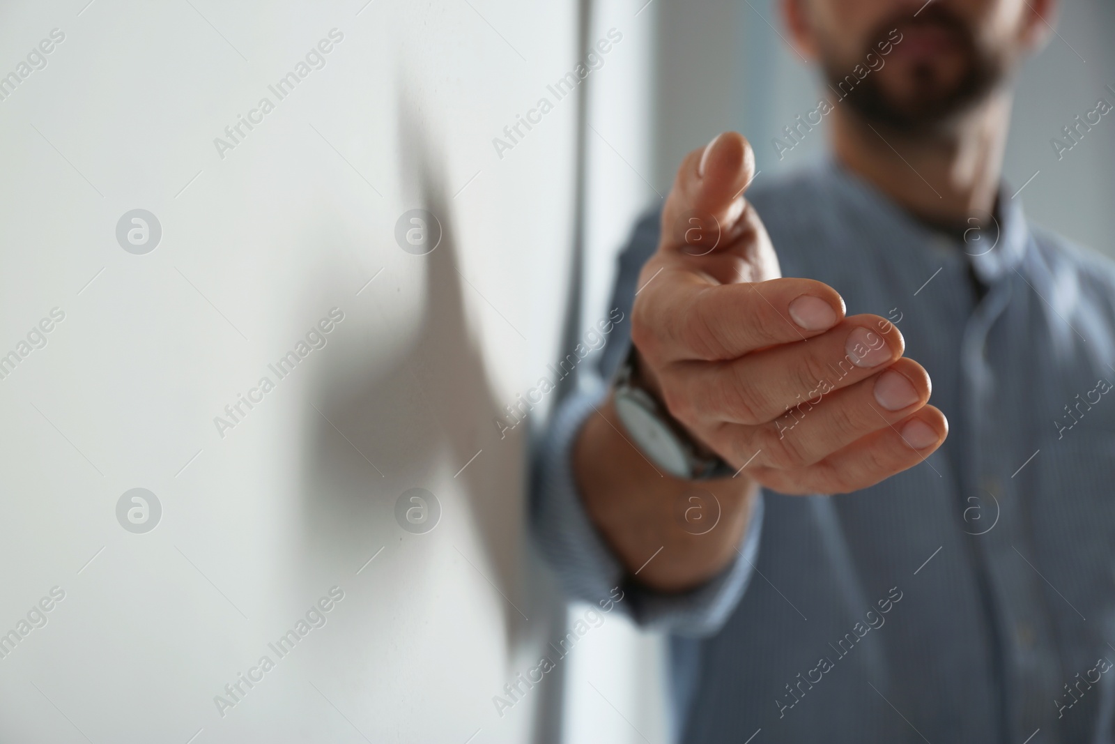Photo of Man giving hand to somebody, closeup with space for text. Help and support concept