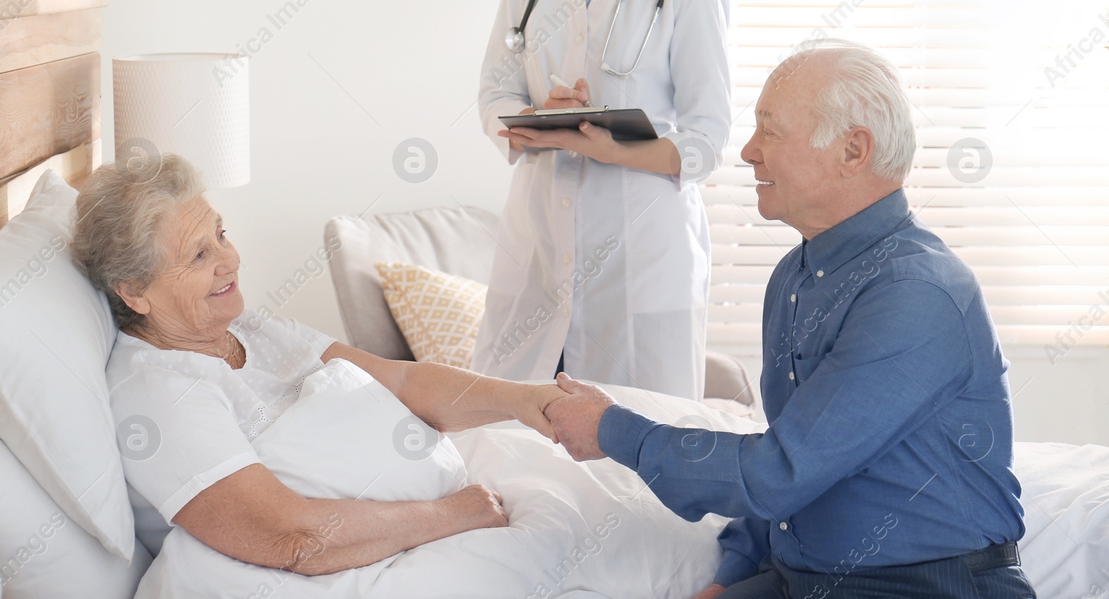 Image of Senior couple and doctor in hospital ward. Banner design