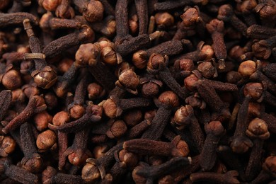 Many aromatic cloves as background, top view