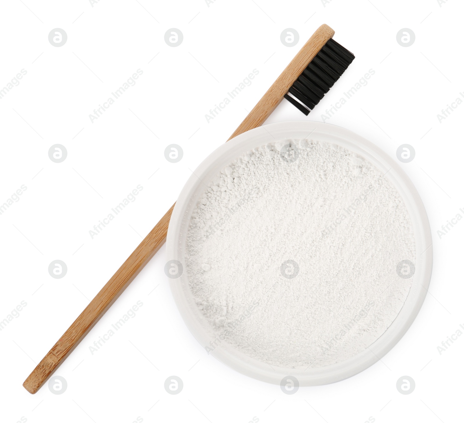 Photo of Bowl of tooth powder and brush on white background, top view