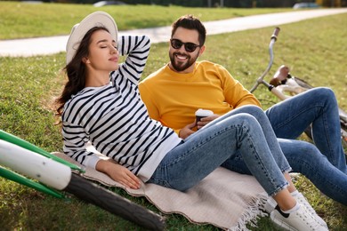 Photo of Beautiful young couple spending time together outdoors