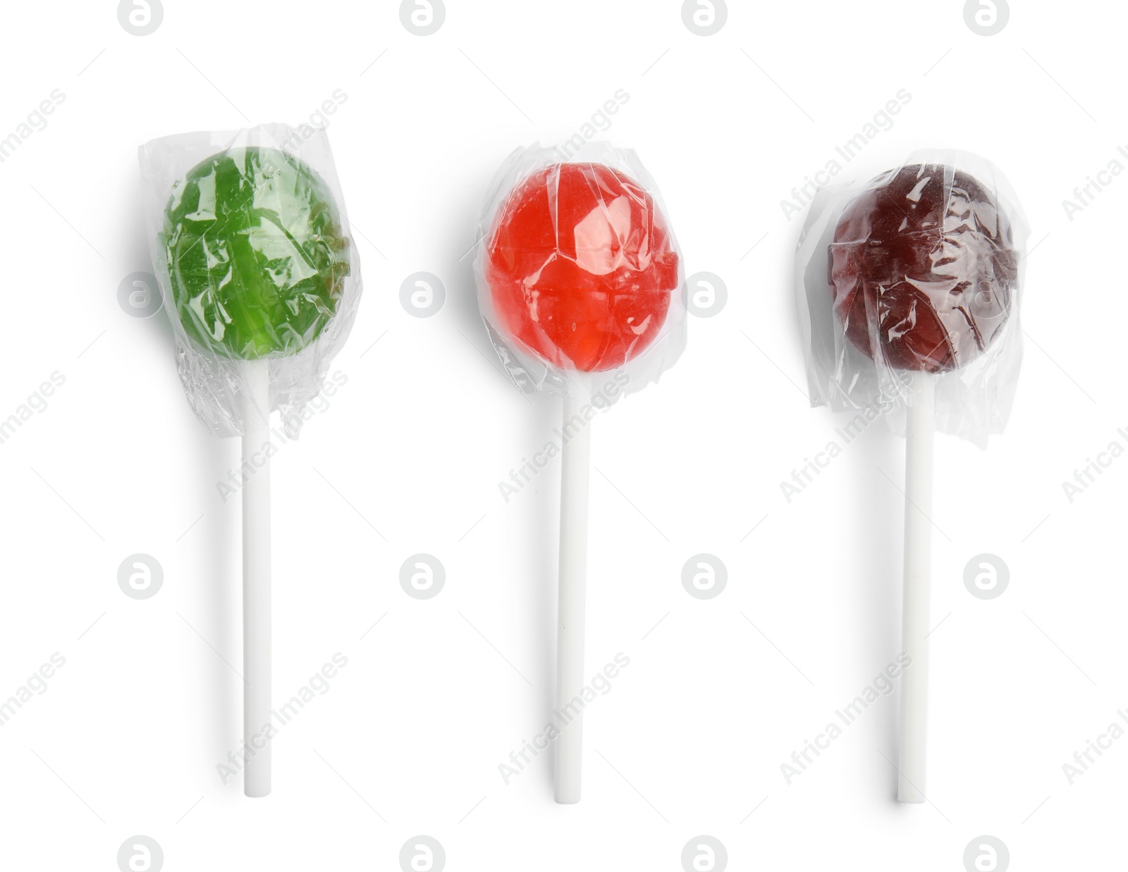 Photo of Delicious colorful candies on white background, top view