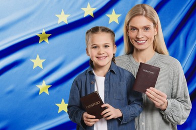 Immigration. Happy woman and her daughter with passports against flag of European Union, space for text