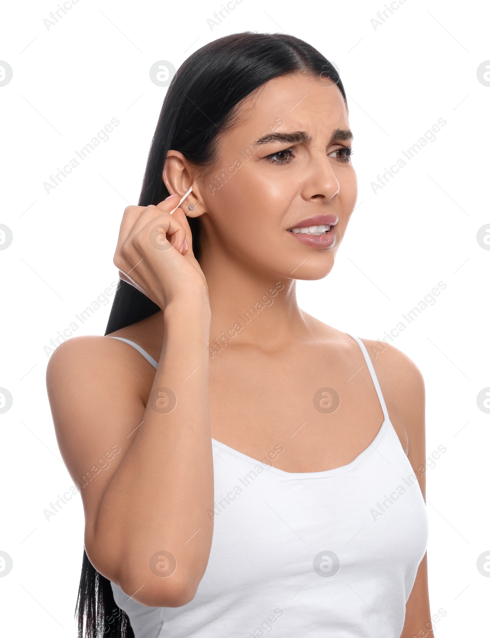 Photo of Young woman cleaning ear with cotton swab on white background