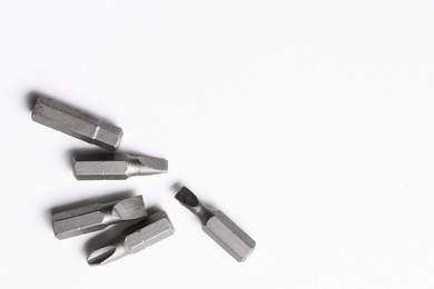 Photo of Different screwdriver bits on white background, top view