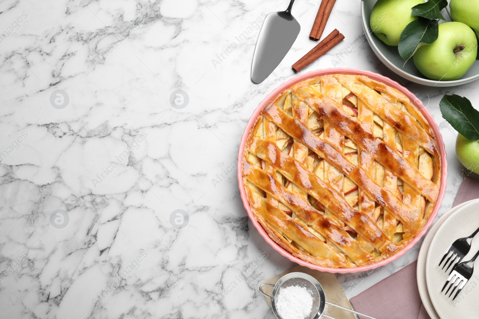 Photo of Flat lay composition with fresh traditional apple pie on white marble table. Space for text