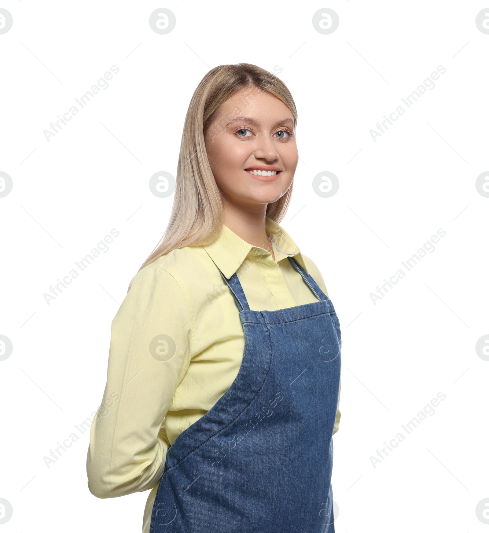 Photo of Beautiful young woman in denim apron on white background