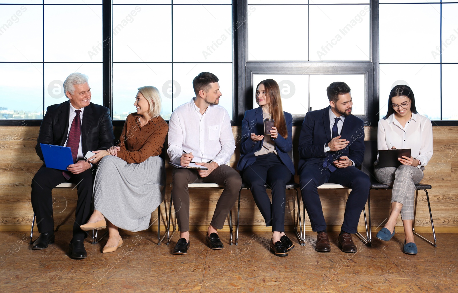 Photo of People waiting for job interview in office hall