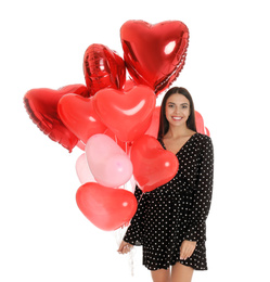 Beautiful young woman with heart shaped balloons isolated on white. Valentine's day celebration