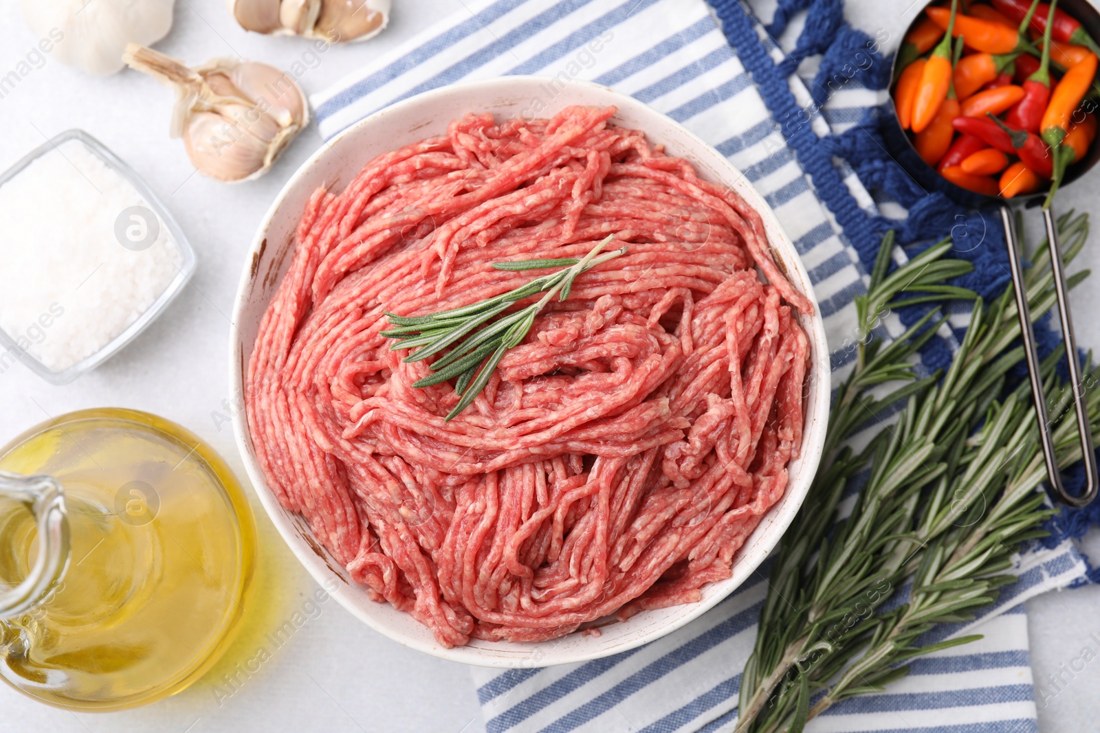 Photo of Flat lay composition with fresh raw ground meat on light table