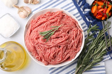 Flat lay composition with fresh raw ground meat on light table