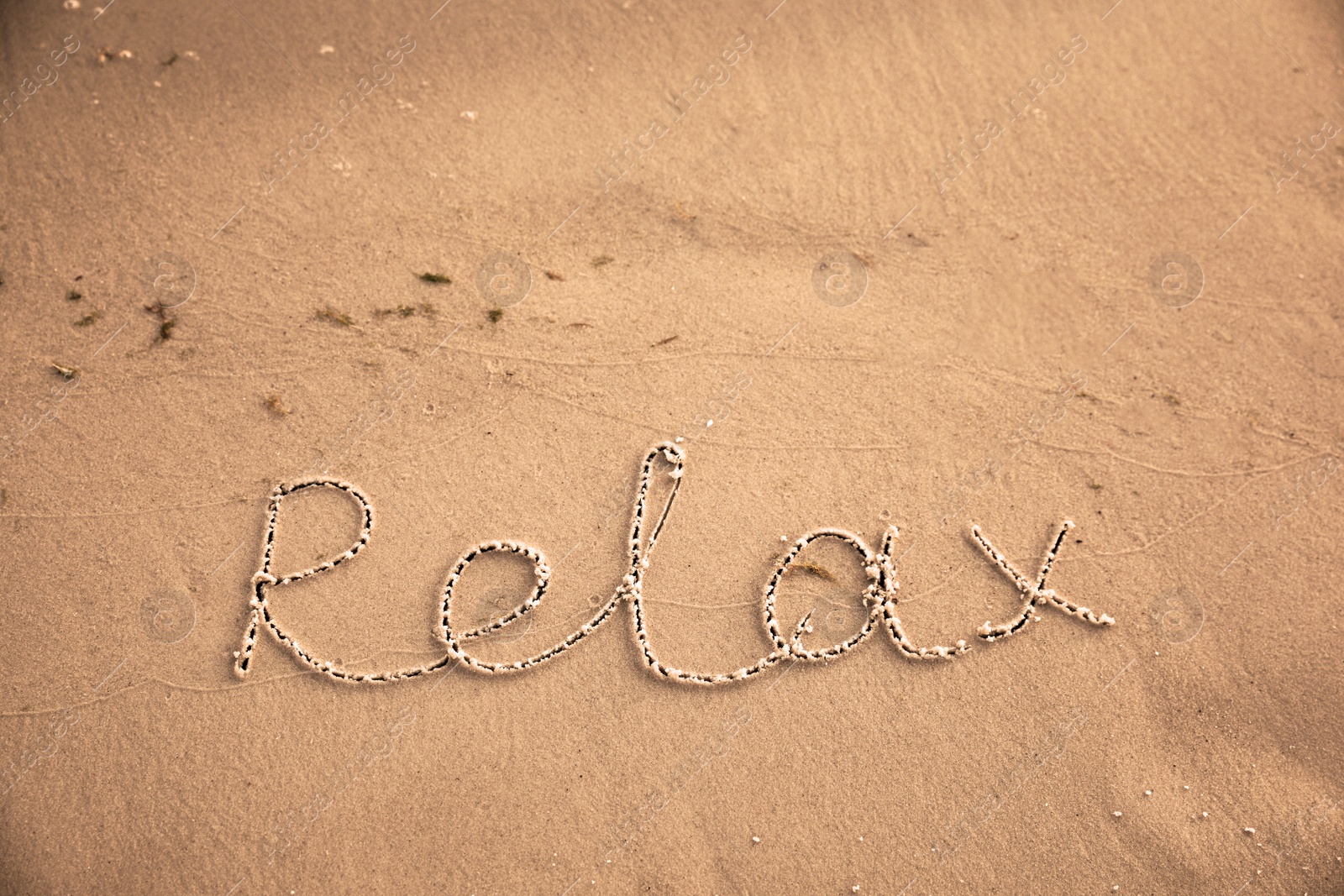 Photo of Sandy beach with written word Relax in summer, above view