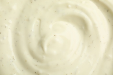 Photo of Tasty homemade garlic sauce as background, top view