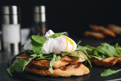 Delicious sandwich with arugula and egg on table, closeup