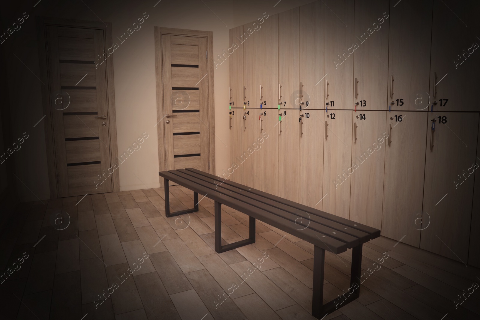 Image of Wooden bench and lockers in changing room interior. Vignette effect