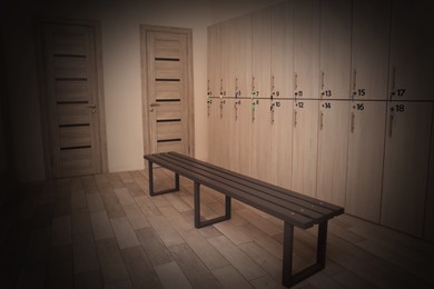 Image of Wooden bench and lockers in changing room interior. Vignette effect