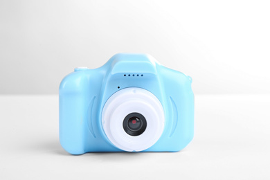 Light blue toy camera isolated on white