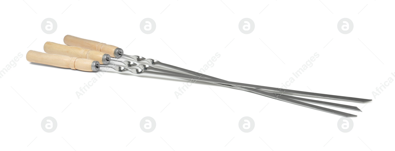 Photo of Metal skewers with wooden handle on white background