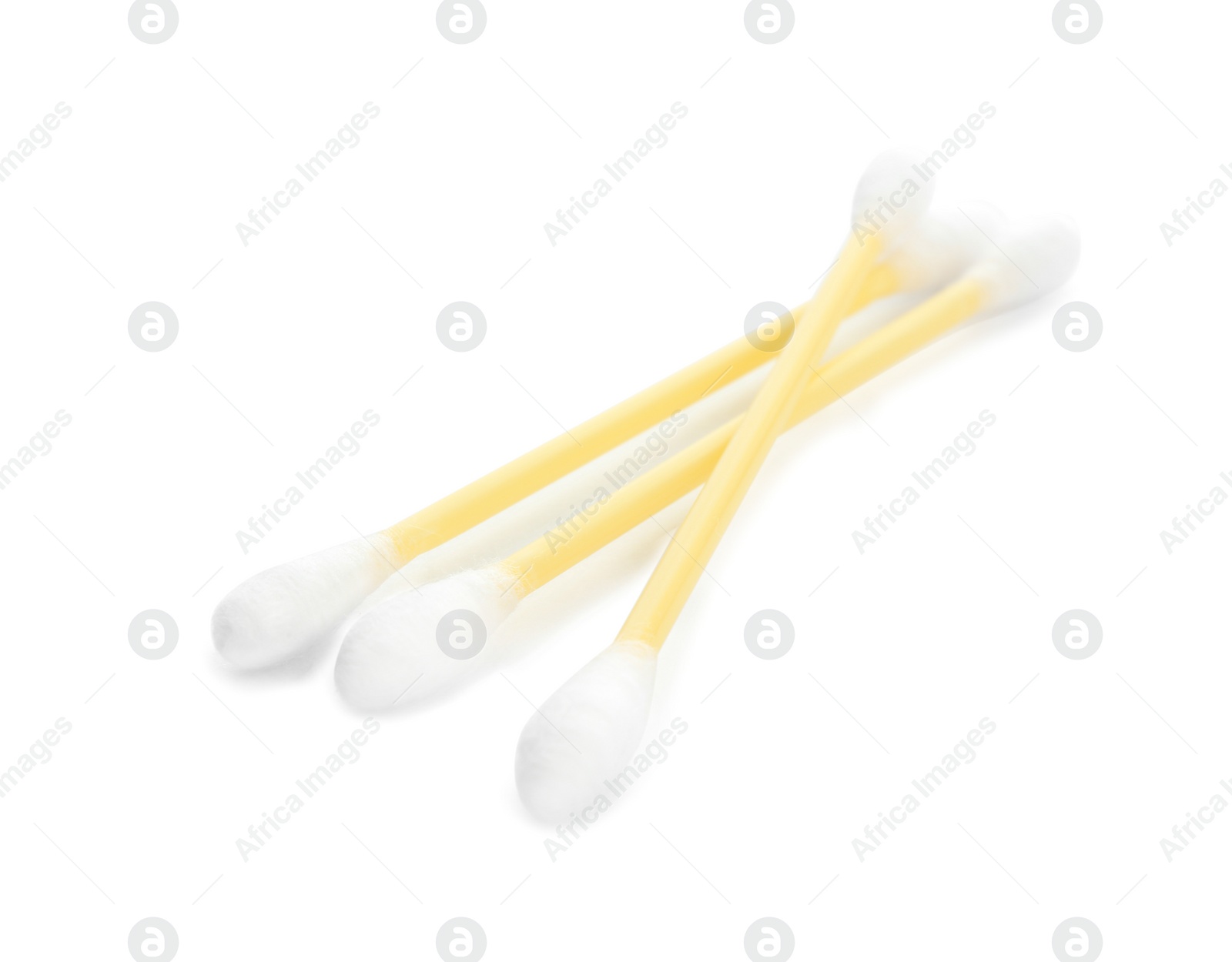 Photo of Yellow plastic cotton swabs on white background