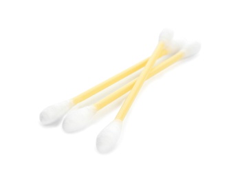 Photo of Yellow plastic cotton swabs on white background