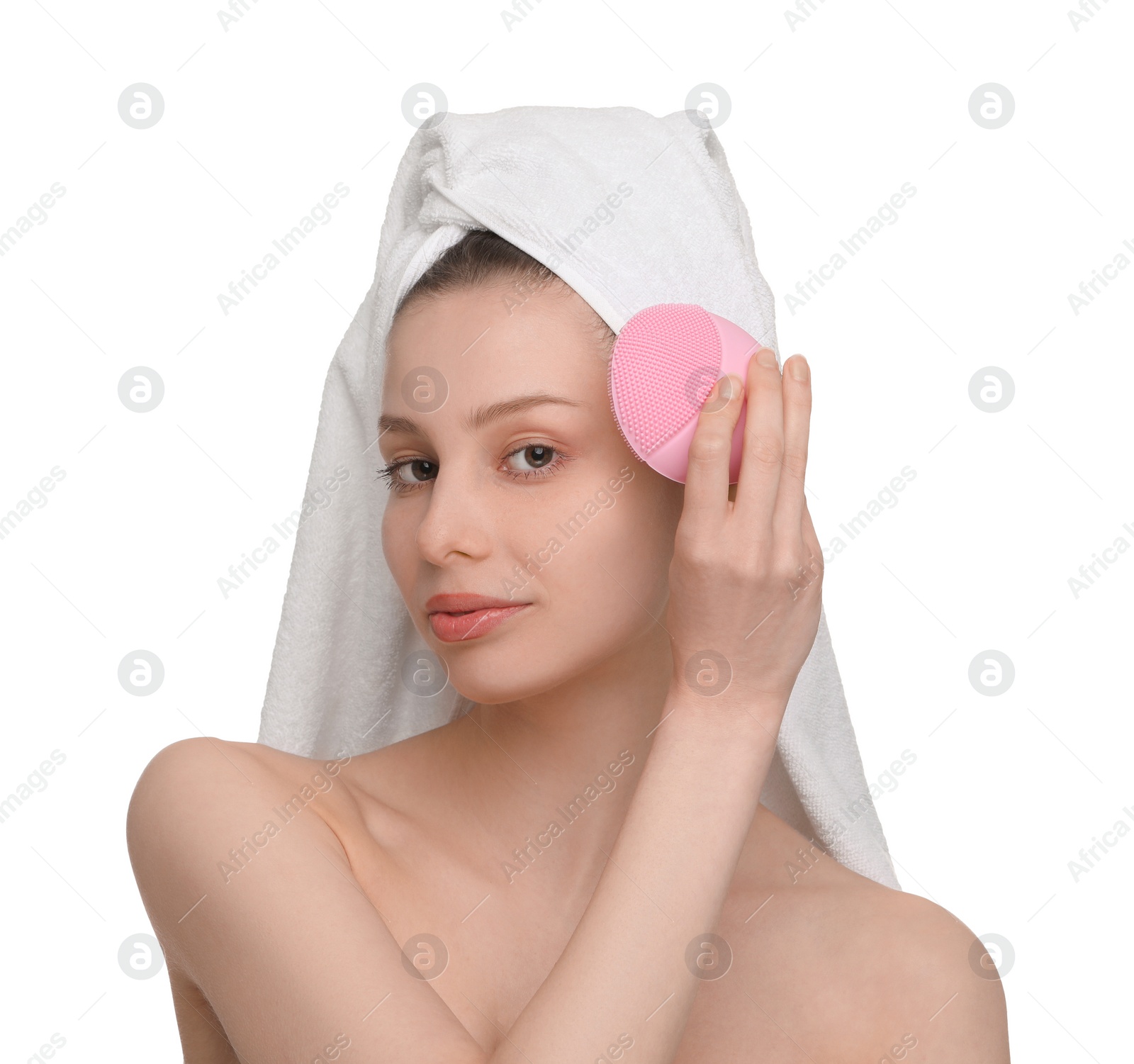 Photo of Washing face. Young woman with cleansing brush on white background