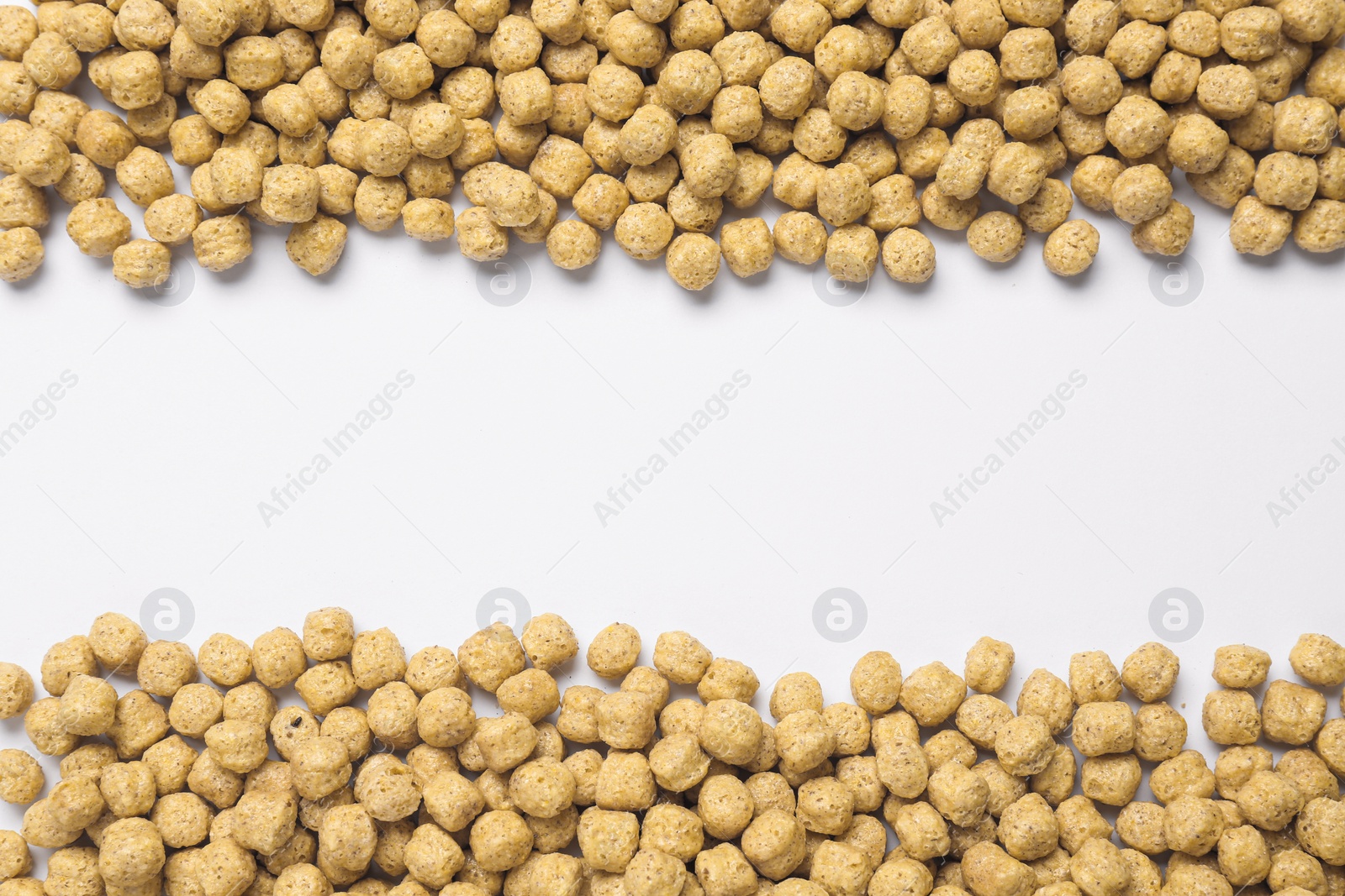 Photo of Sweet tasty corn balls on white background, top view. Space for text