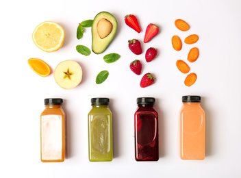 Flat lay composition with healthy detox smoothies and ingredients on light background