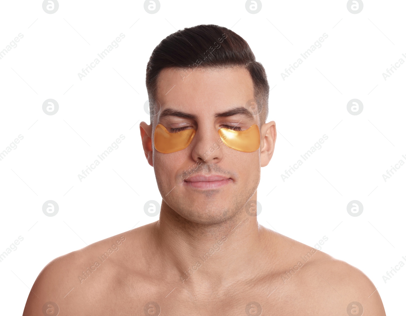 Photo of Man with golden under eye patches on white background