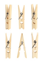 Image of Set with wooden clothespins on white background