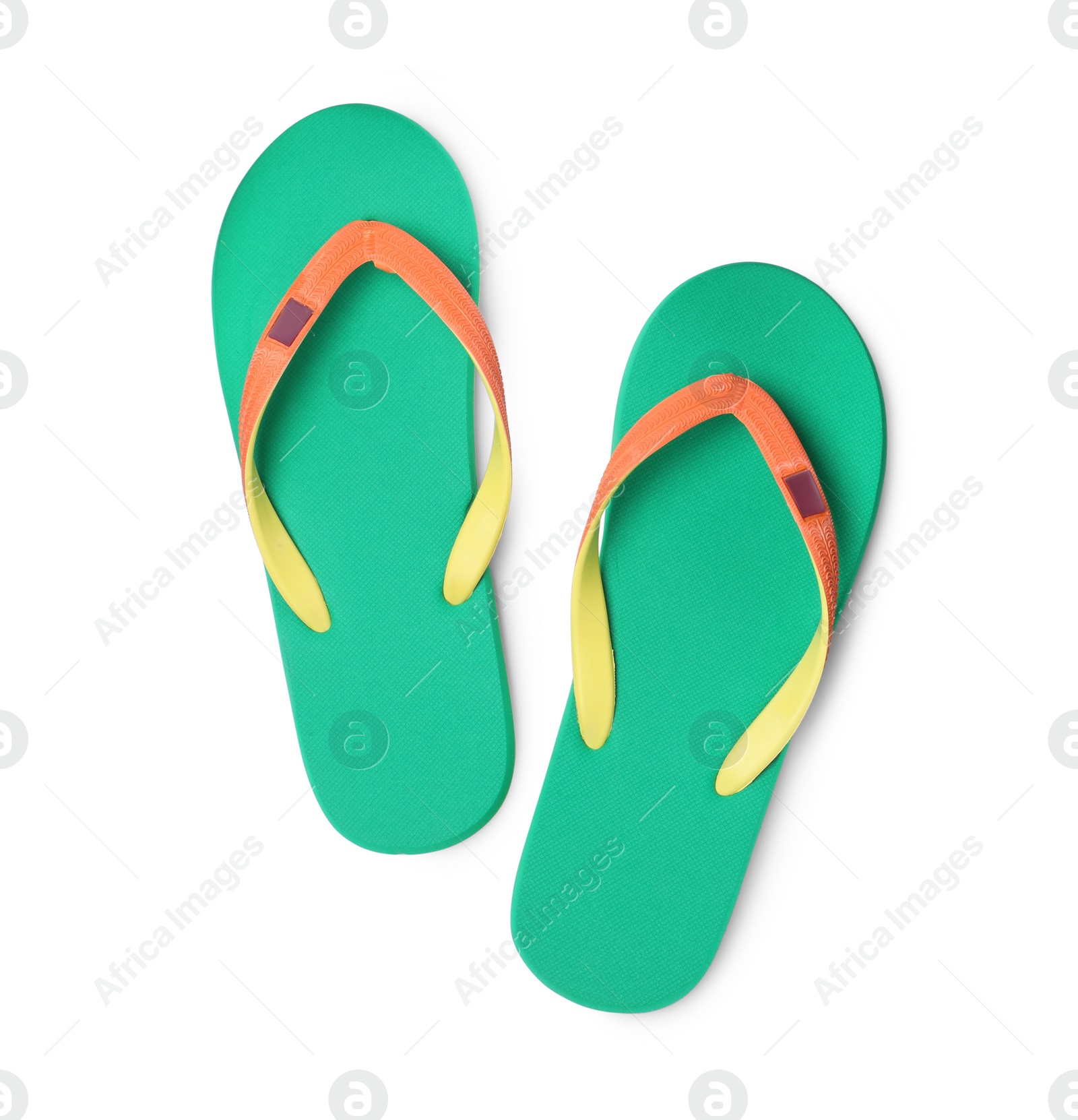 Photo of Pair of stylish bright flip flops isolated on white, top view