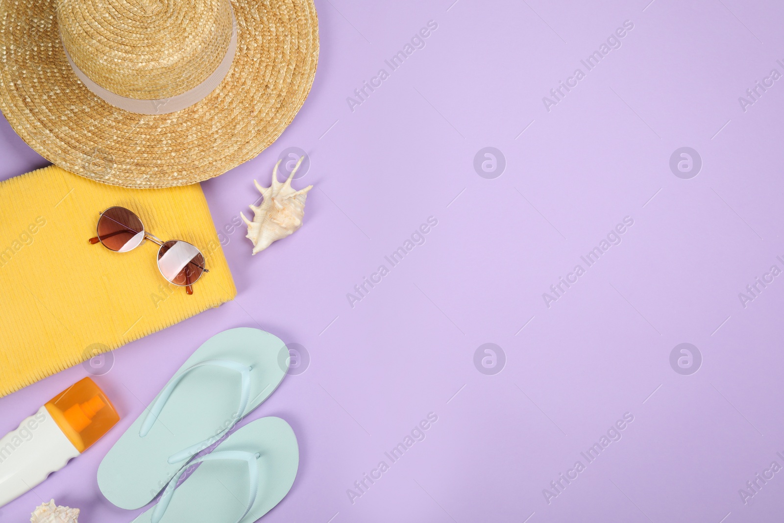 Photo of Flat lay composition with beach objects on violet background, space for text